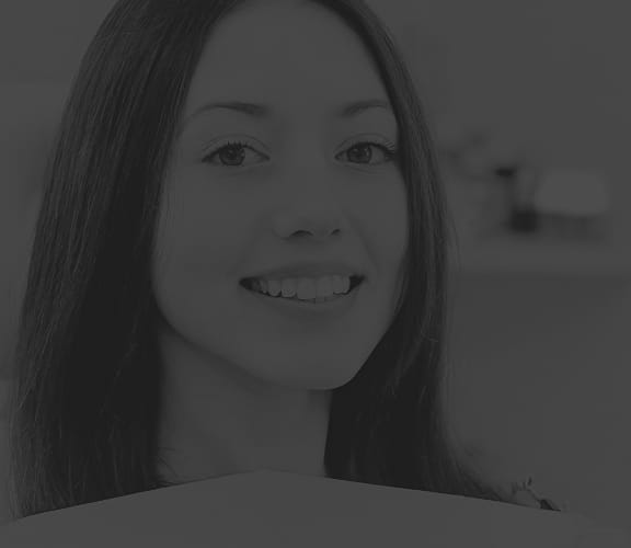 Woman sitting comfortably in a dental chair