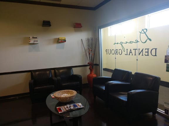 Interior view of reception area with leather chairs and table